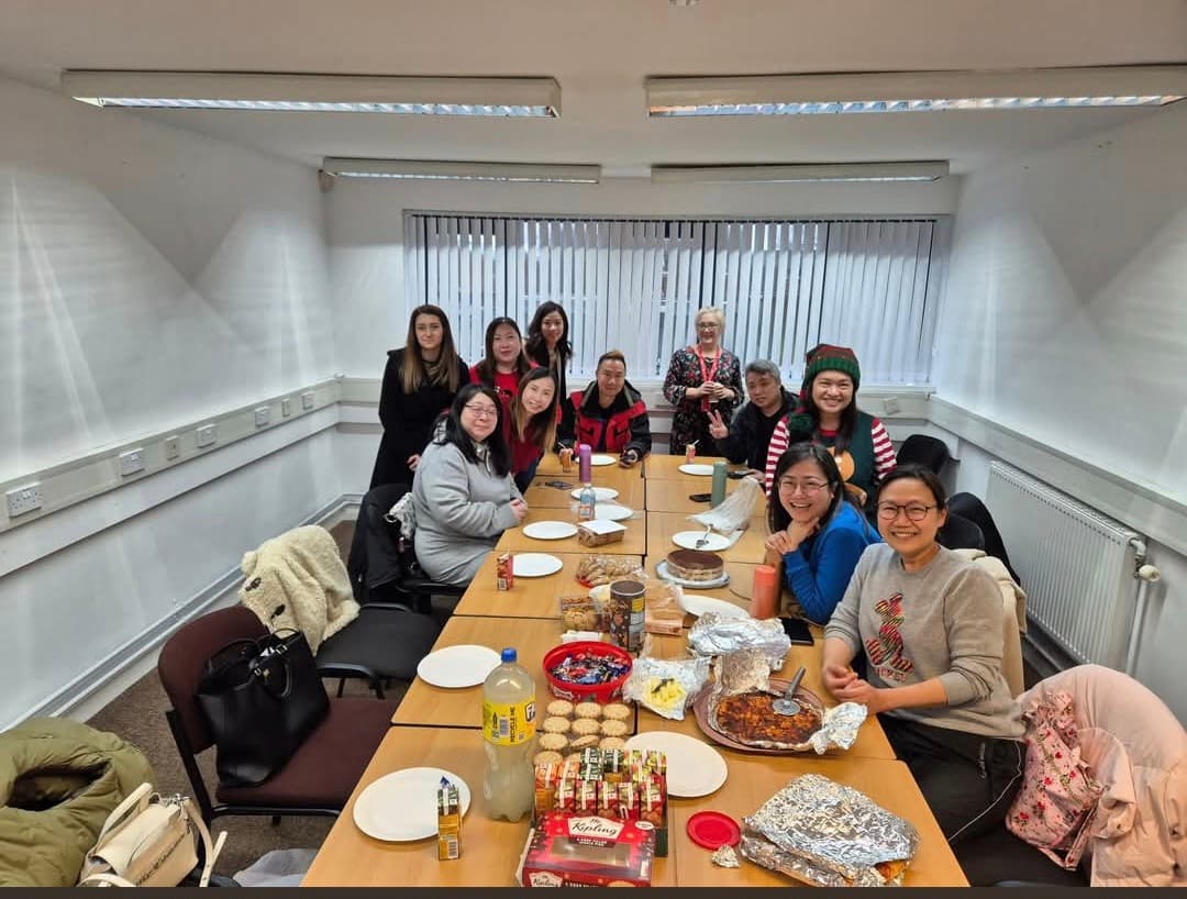 People sharing food around the table at a WLCC community session